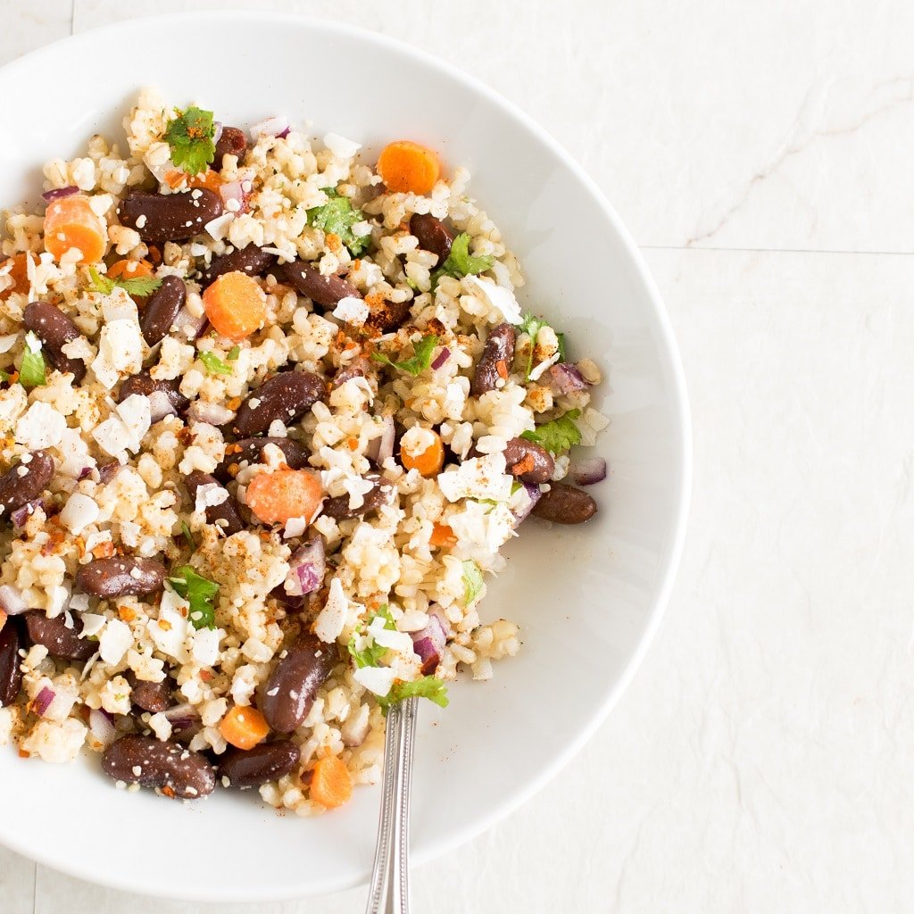 Top view of Brown Rice Kidney Bean Salad with Coconut Sriracha Dressing