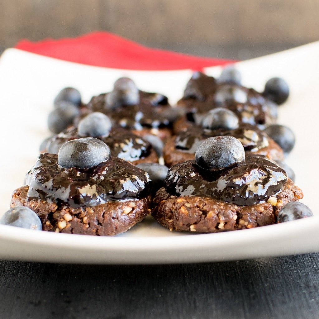 A front view of No Bake Chocolate Walnut Cookies with Blueberry Jam Frosting 