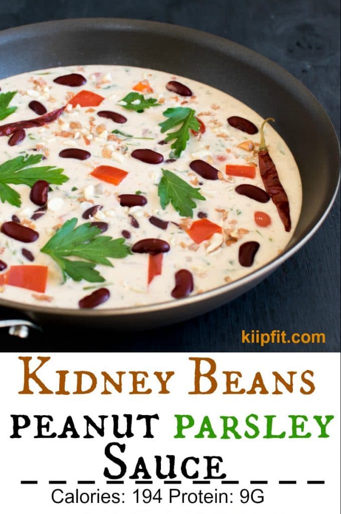 A 45 degree angle view of Kidney Beans in Peanut Parsley Sauce