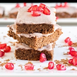 A big stack of Pomegranate Frosted Flourless brownies is shown