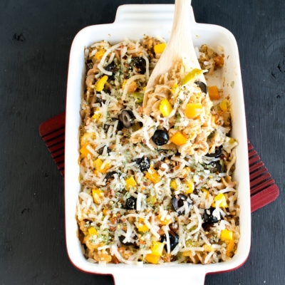 A spatula showing baked cashew cream vegetable pasta