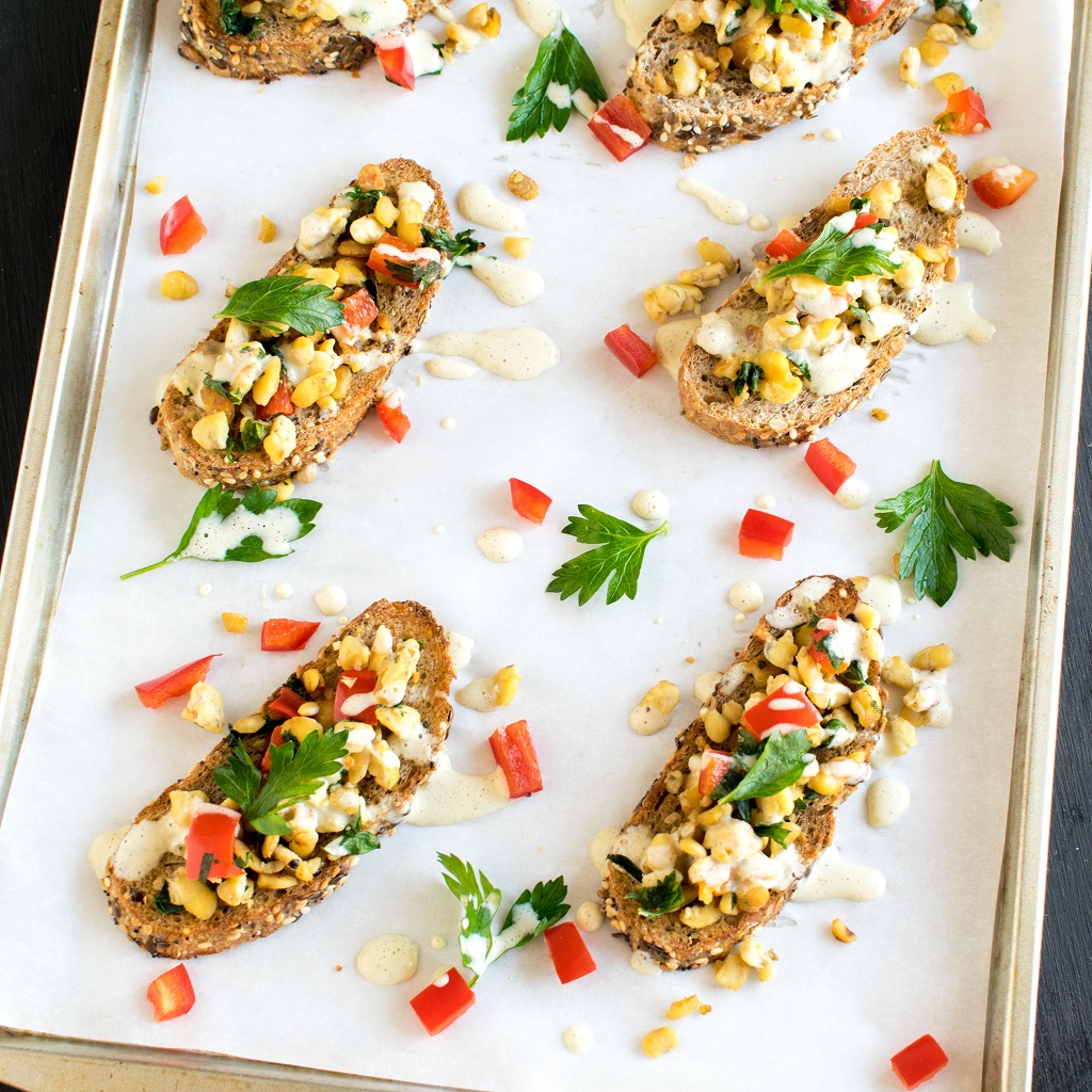 Top view of Herbed Cashew Cream Tempeh Crostini is shown