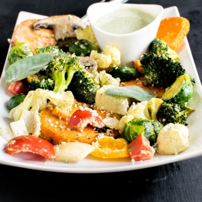 A front view of Vegan Herb Hemp Roasted Vegetables is made with fiber rich vegetables and tossed in mouthwatering hemp seed dressing. It’s not only delicious but is also nutrient dense. This side dish is packed with absolutely desirable ingredients and is a crowd pleaser. Vegan Herb Hemp Roasted Vegetables