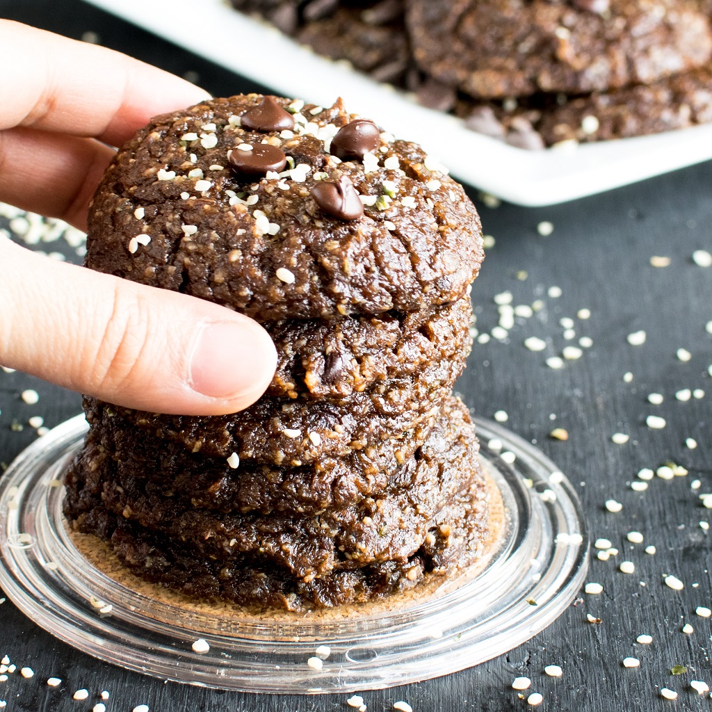 A hand reaching out for the cookies is shown in the image