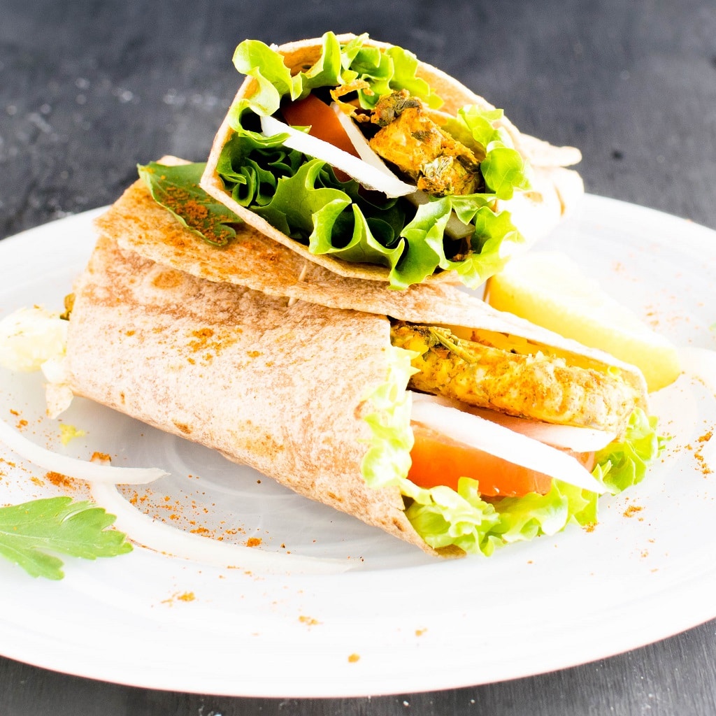 A close up view of Moroccan Spiced Tempeh Wrap is shown in this image | kiipfit.com