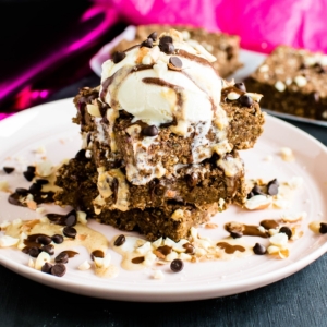 A front view of stacked peanut butter chocolate brownies.