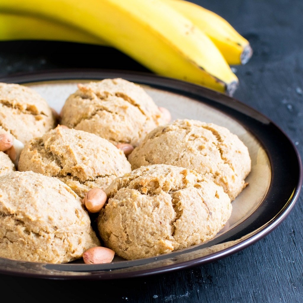 Loads of Peanut Butter Banana Amaranth Cookies are shown in a plate with raw peanuts and banana as the props | kiipfit.com