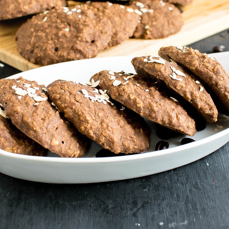 vegan Mocha Oatmeal Cookies are display in a white rectangle serving bowl.