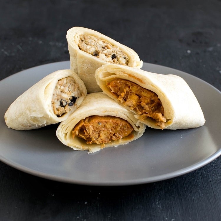 Cooked Alpha Burritos on a plate are shown in this image