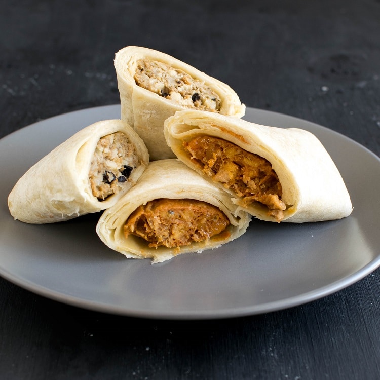 Cooked Alpha Burritos on a plate are shown in this image