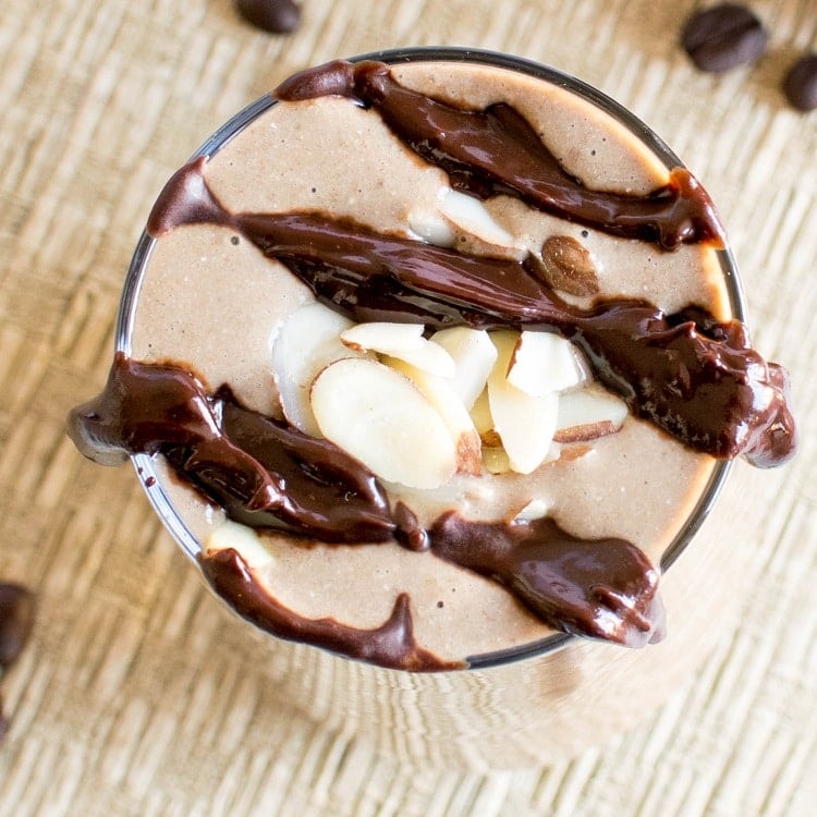 A closer top view of Chocolate Mocha Protein Smoothie with the garnishes is shown in this image