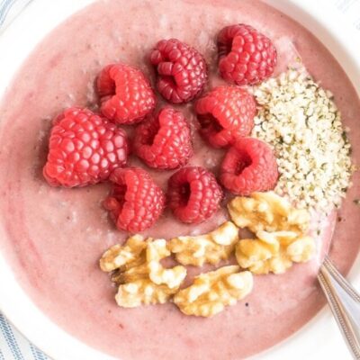 A top view of raspberry smoothie bowl (vegan)