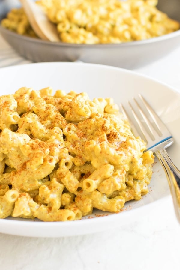 Plated Moroccan Tempeh Mac and Cheese with a fork