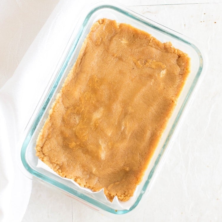 A second layer of peanut butter mixture in the rectangle pan