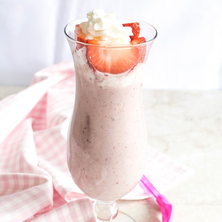 a close up view of served strawberry shortcake smoothie.