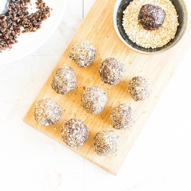 No Bake Chocolate Quinoa Protein Balls on wooden board with a top view