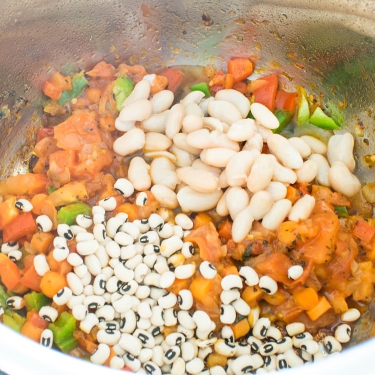 beans are being cooked along with other ingredients
