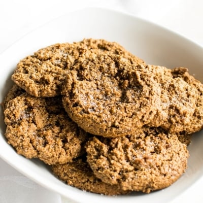 A bowl loaded with almond flour vegan ginger cookies