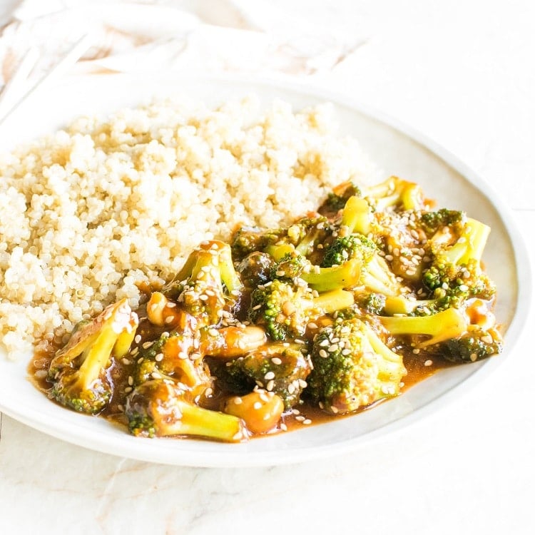 Broccoli Stir Fry in a serving plate with a side of cooked quinoa