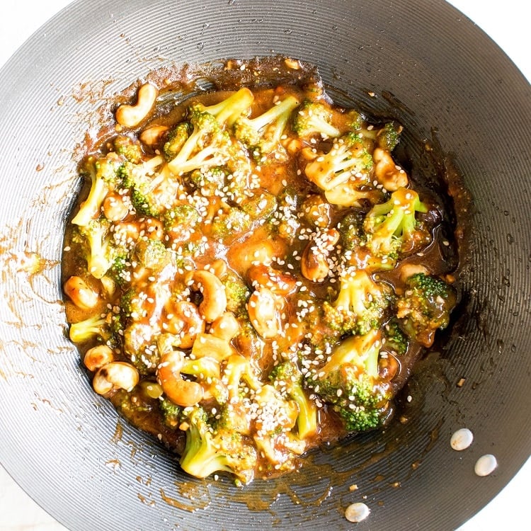 Spicy Cashew Broccoli Stir Fry garnished with sesame seeds in the wok