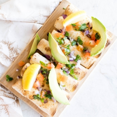 Top view of Baked Taquitos on a wooden board