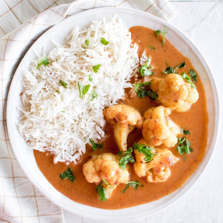 Top view of cauliflower tikka masala with rice