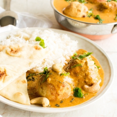 Malai Kofta with naan and rice in a 45 degree angle view