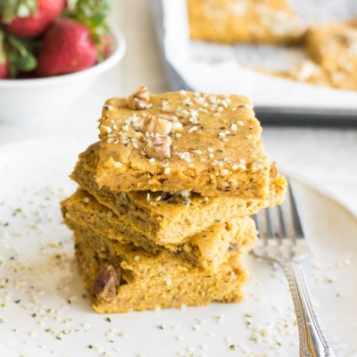Front view of stacked sweet potato pancakes in sheet pan