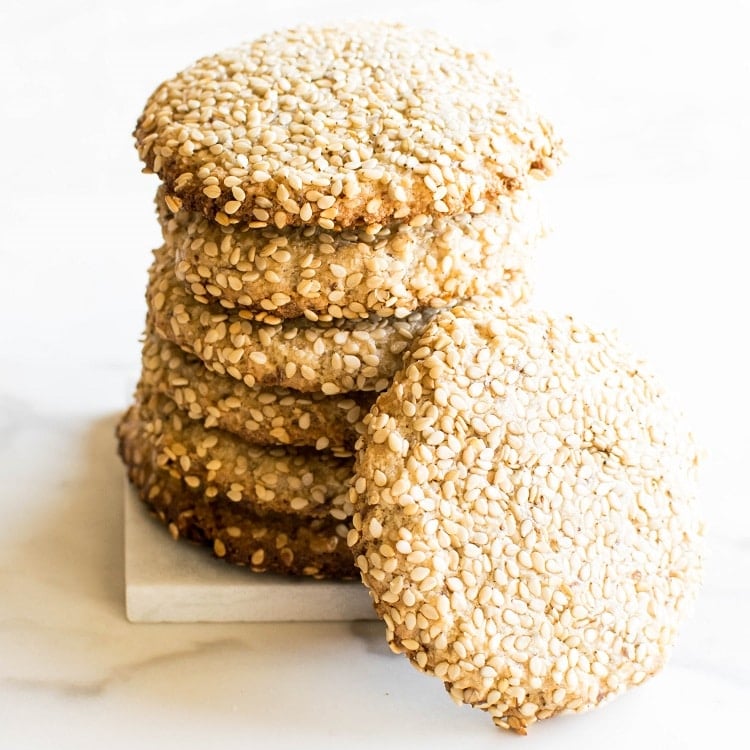 Stack of one bowl tahini cookies with one cookie at the front