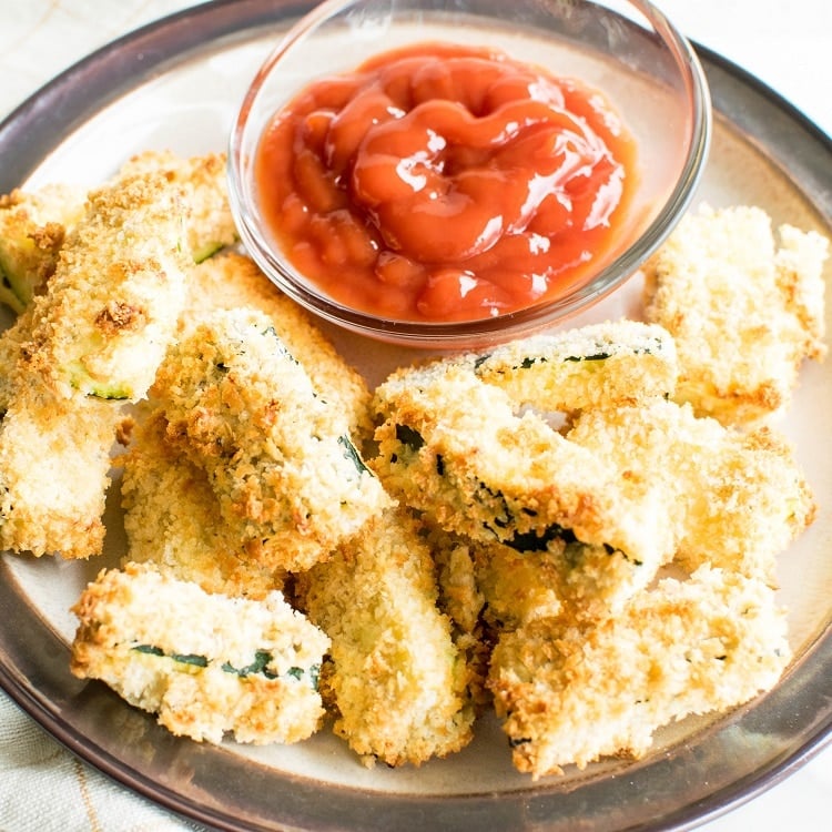 A 45 degree angle view of air fryer zucchini fries