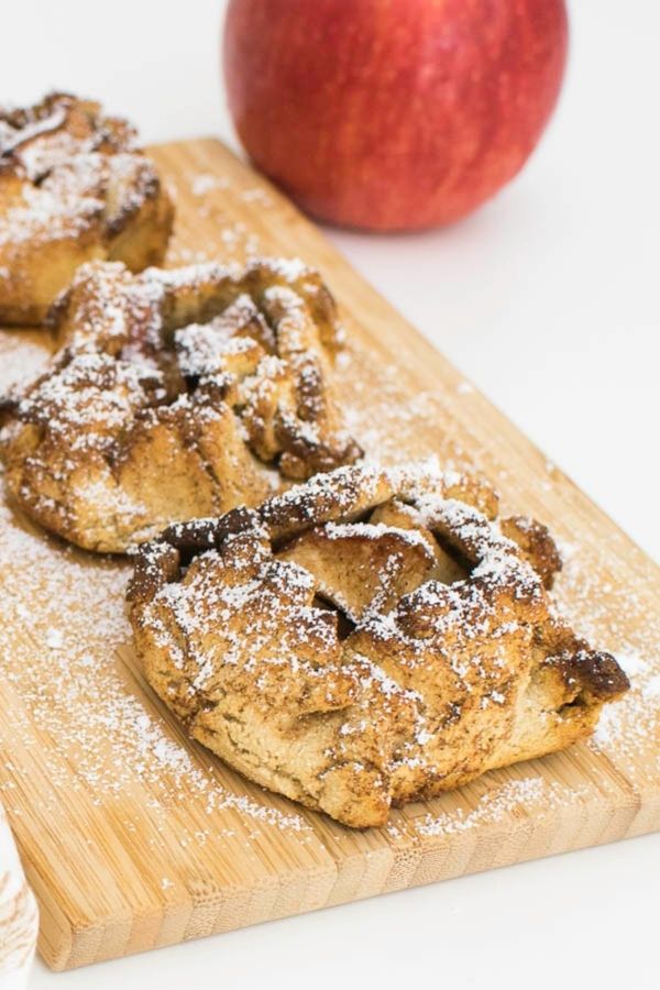 Air Fryer Apple Dumplings displayed on a wooden board.