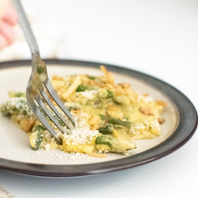 A fork digging into vegan green bean casserole recipe