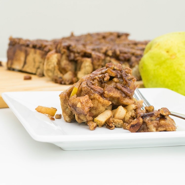 pear stuffed pecan sticky buns served in a plate.