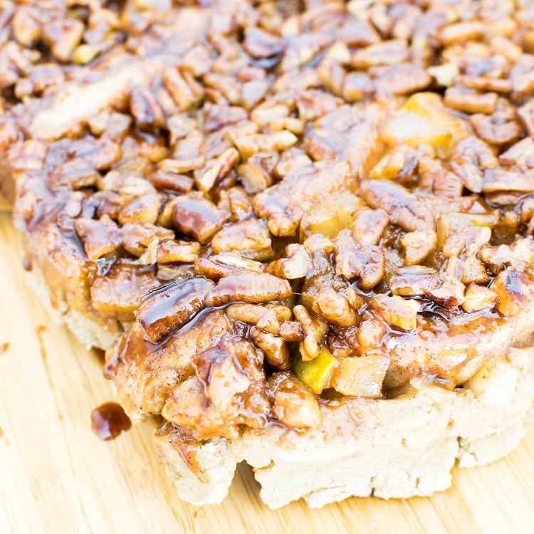 a close up view of pear stuffed pecan sticky buns.
