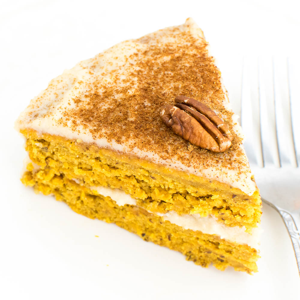 A close up view of a slice of pumpkin cake recipe with quinoa flour.