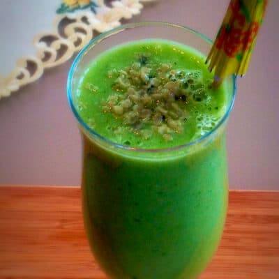 A tall glass filled with Cucumber Kale Ginger Smoothie