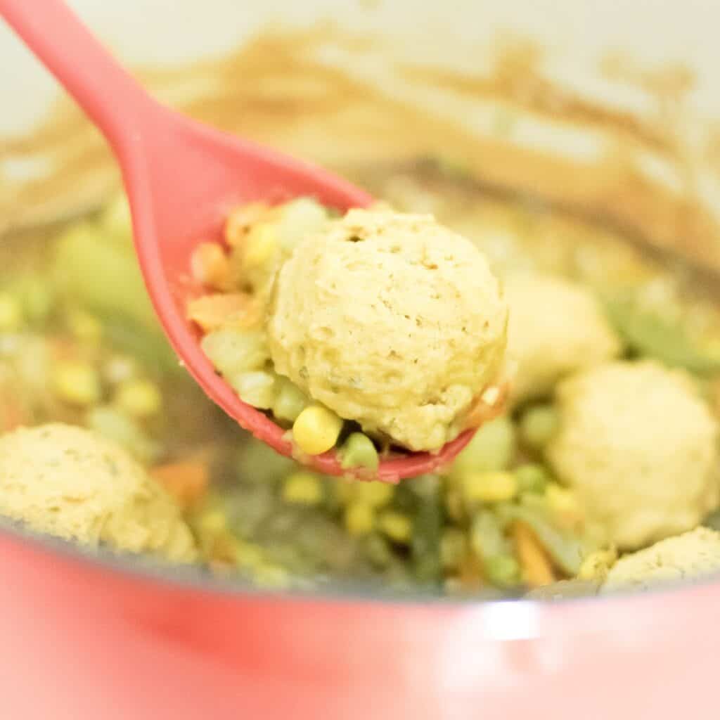 vegan pot pie with chickpea flour biscuits in a spatula.