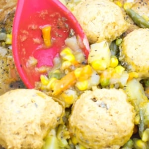 a close up view of vegan pot pie with chickpea flour biscuits