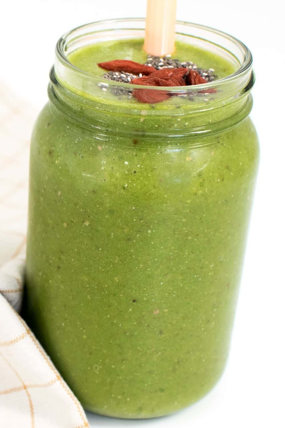 a front view of kale smoothie in a serving glass. 