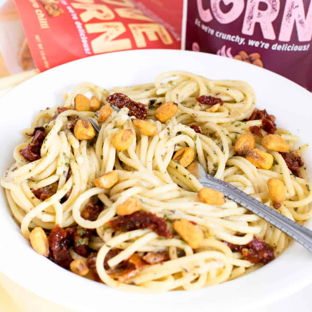 a front view of vegan carbonara with corns as the topping. 