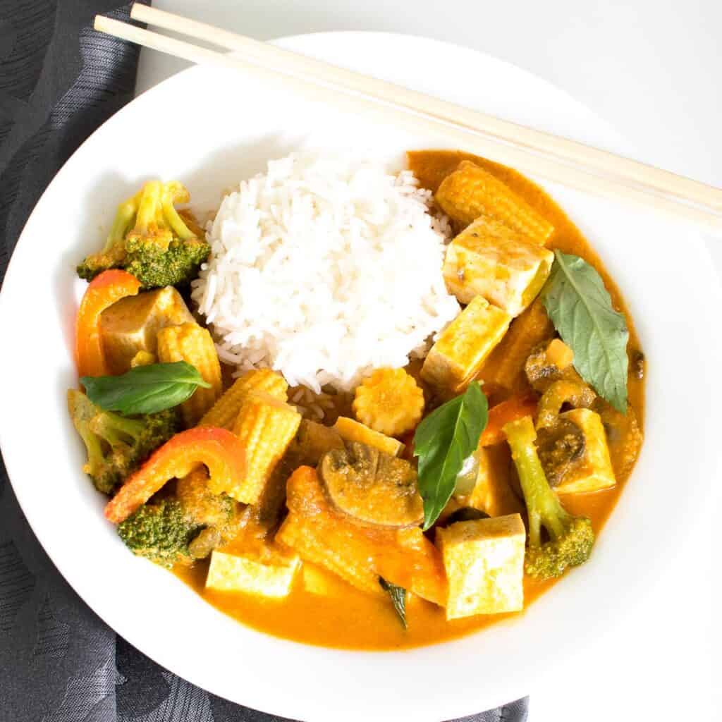 top view of Thai red curry vegetables served with rice.