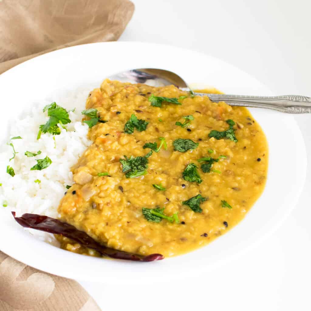 a 45 degree angle view of red lentil dal.