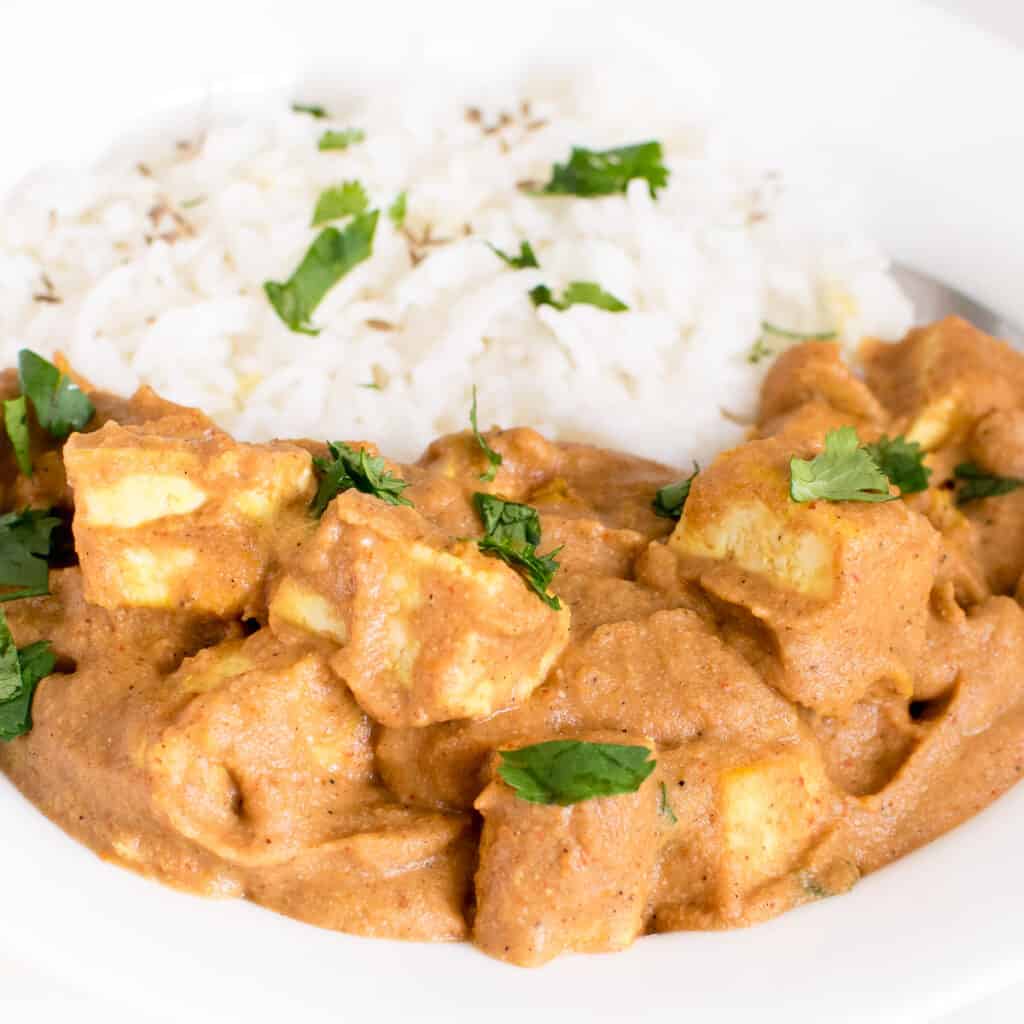 a close up view of tofu tikka masala in a serving plate.