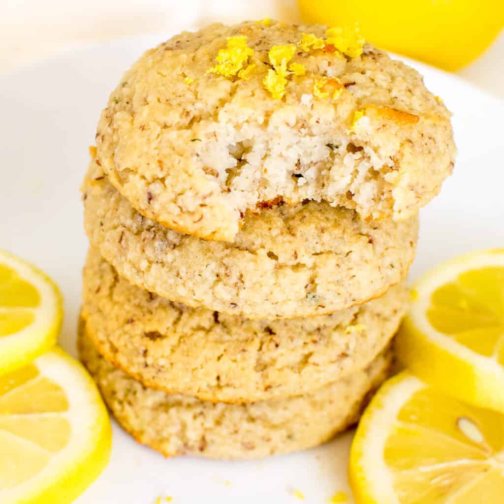 a 45 degree angle view of half eaten vegan lemon cookies.