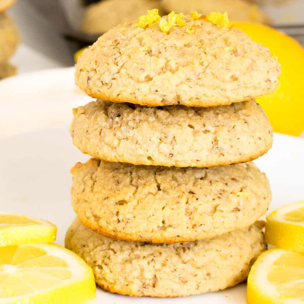 a front view of stacked vegan lemon cookies.