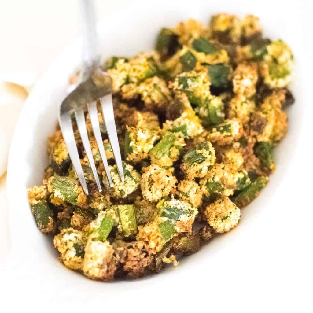 a fork digging into air fryer okra.