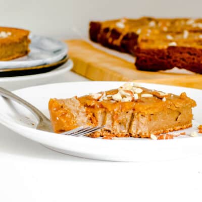 a front view of a half eaten slice of peanut butter cake.