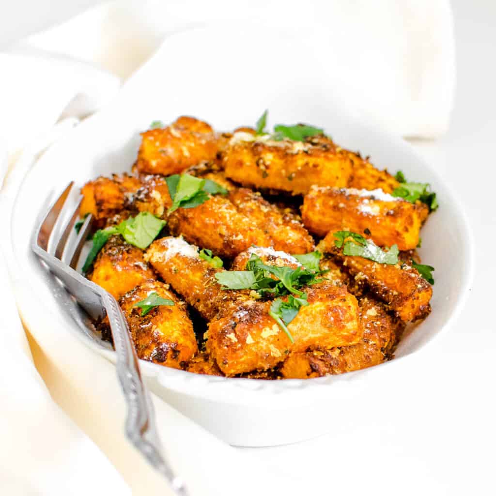 a front view of air fryer carrots in a serving plate.