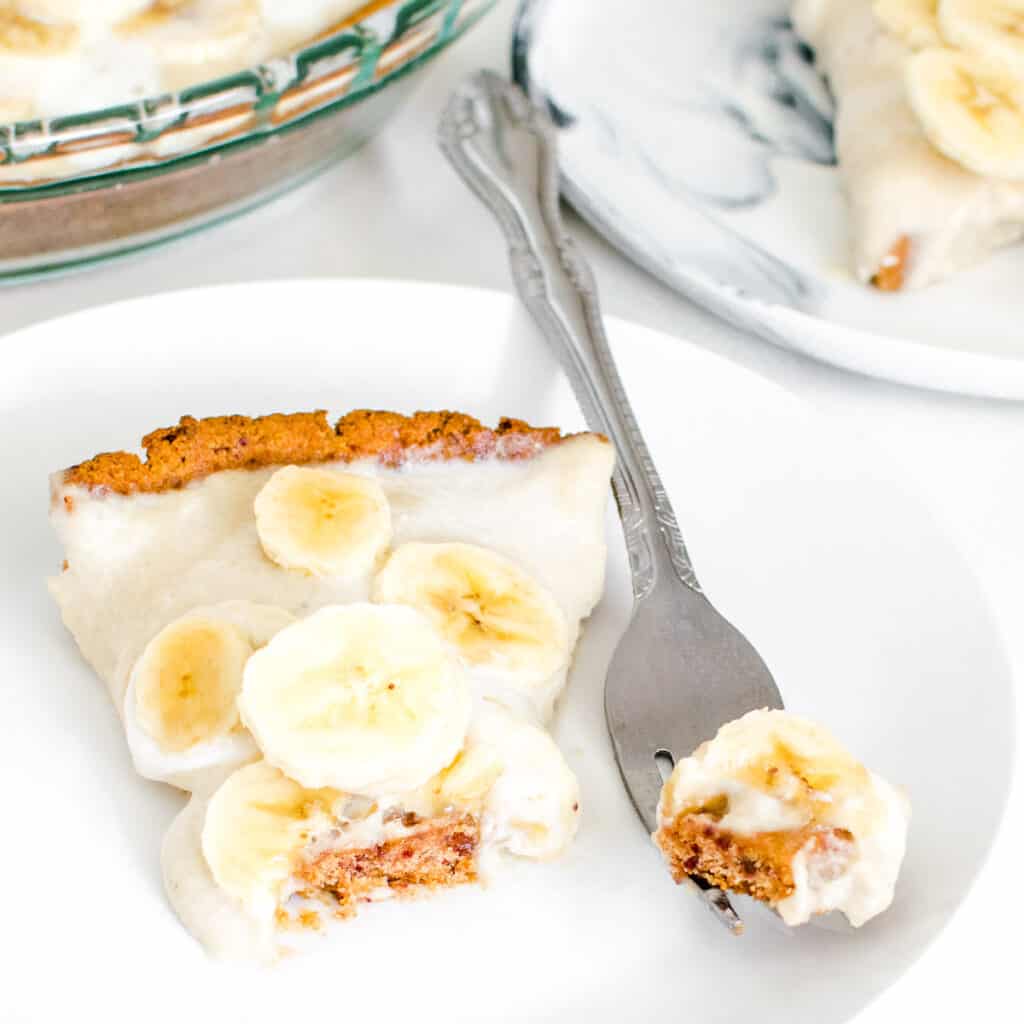 a fork with a piece of vegan banana cream pie.