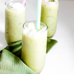 a front view of serving glassed with iced matcha latte